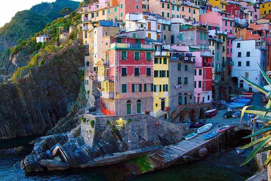 Riomaggiore colorful homes on the cliff by the water