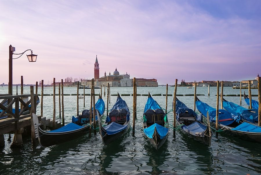Venice gondolas on the canal at sunset